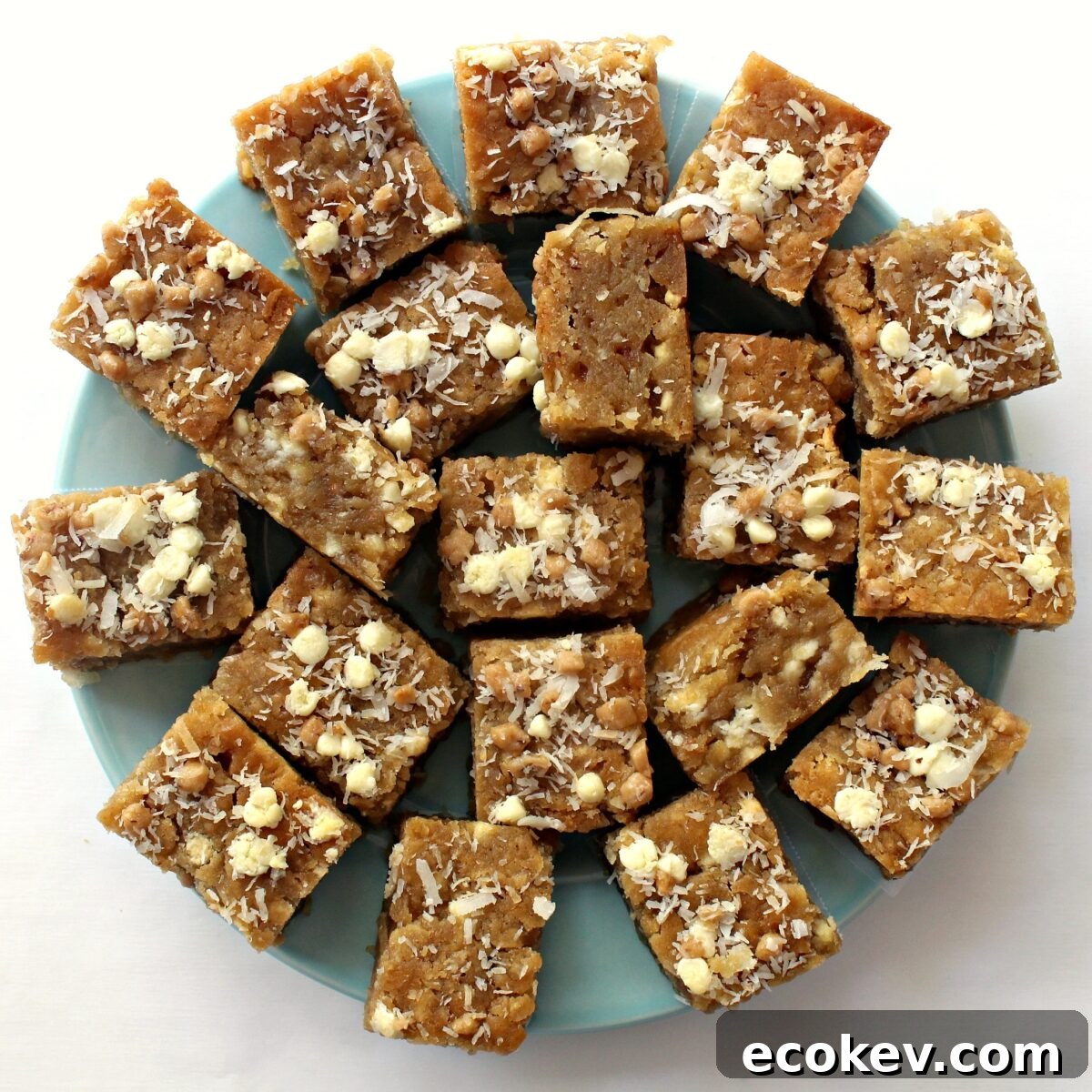 Coconut Blondies on a blue serving plate.