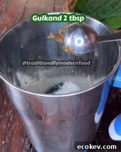 Gulkand being added for sweetness and rose flavor in the betel leaf drink.