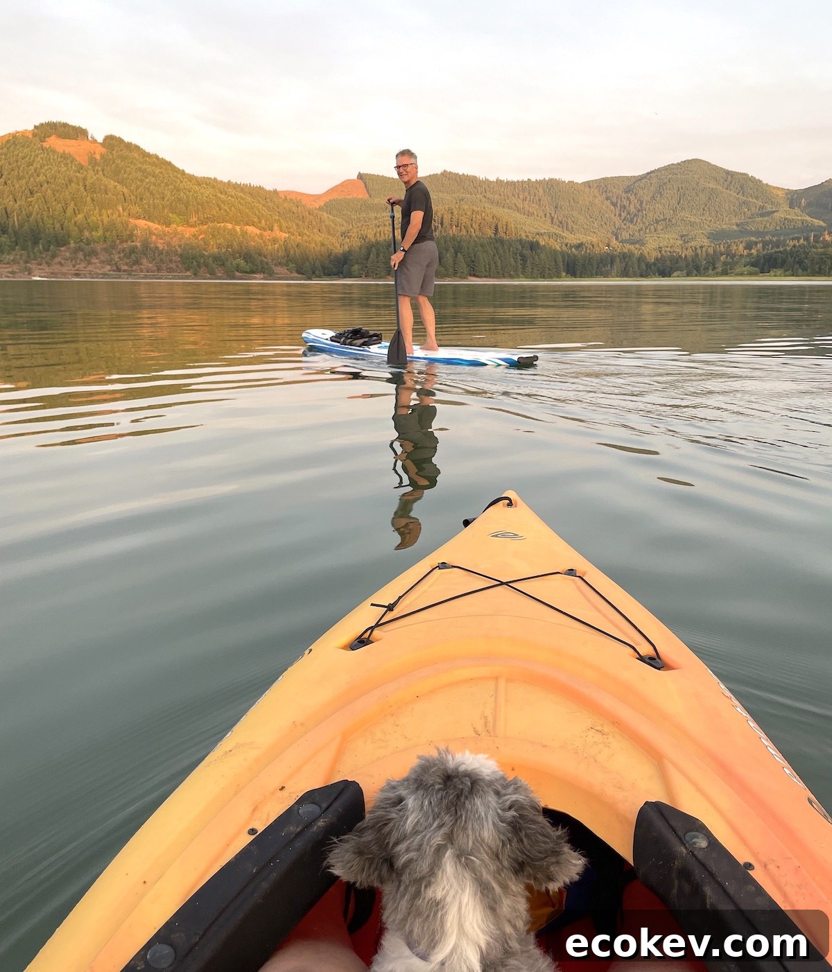 paddling on a lake with a paddle board and kayak