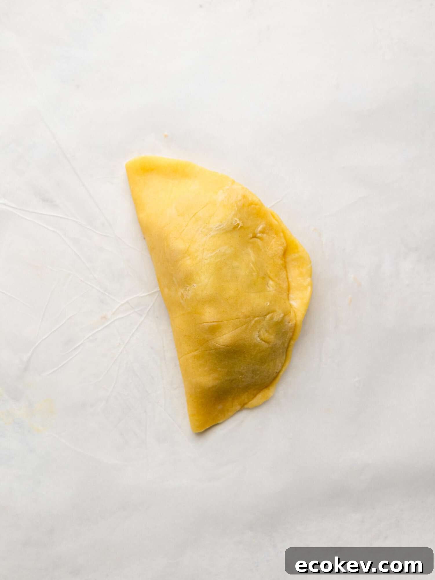 A closed caprese empanada.