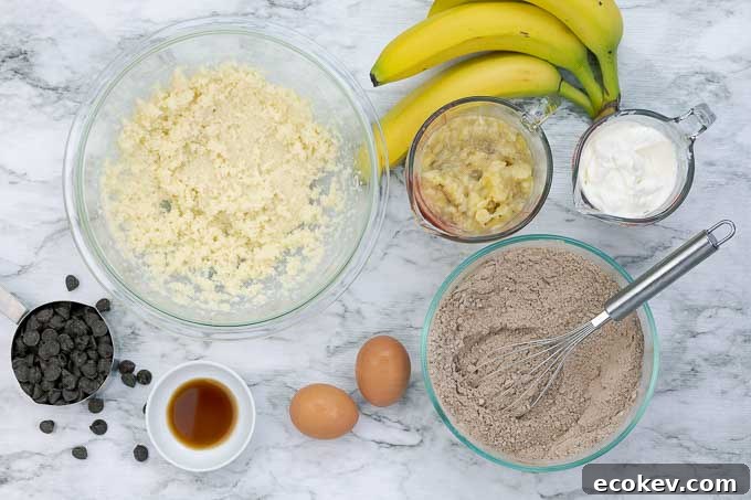 bowl of wet ingredients and bowl of dry ingredients being prepared for double chocolate banana muffins