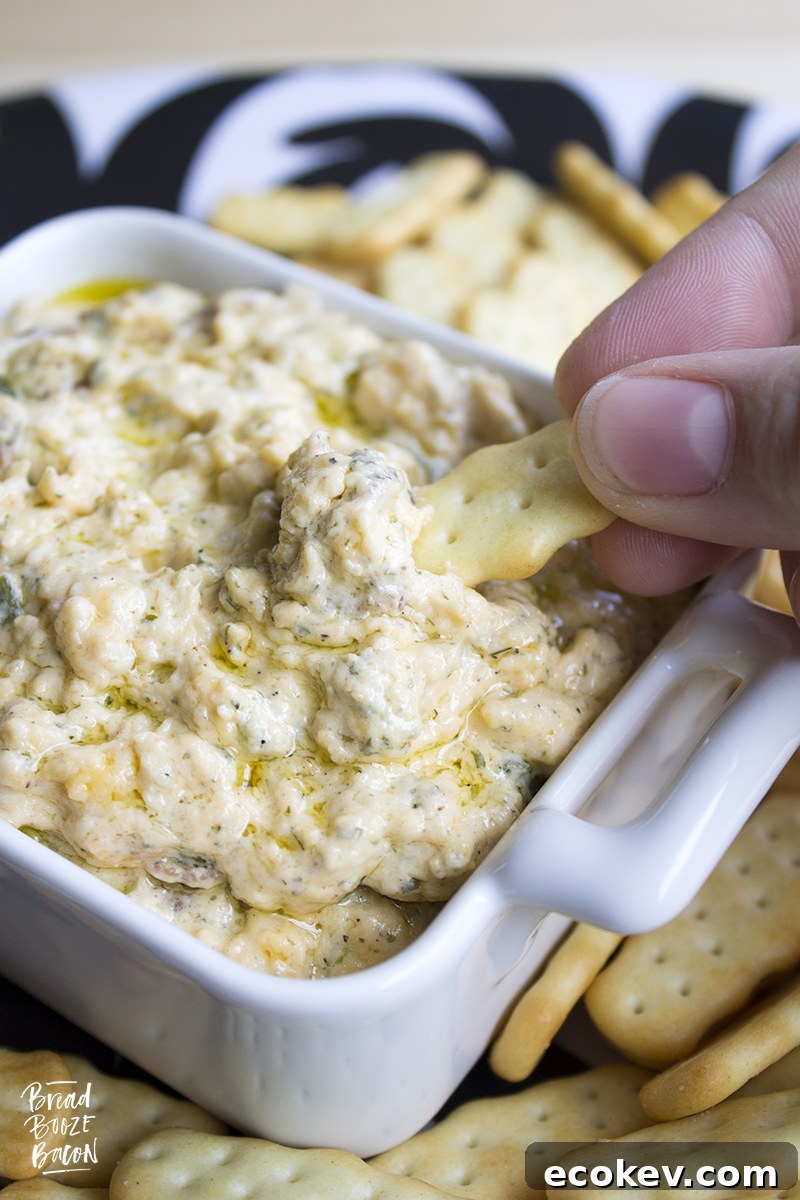 Slow Cooker Bacon Ranch Dip is my go to dip for game day. Super cheesy and studded with bacon, this easy to make dip is always a crowd pleaser!