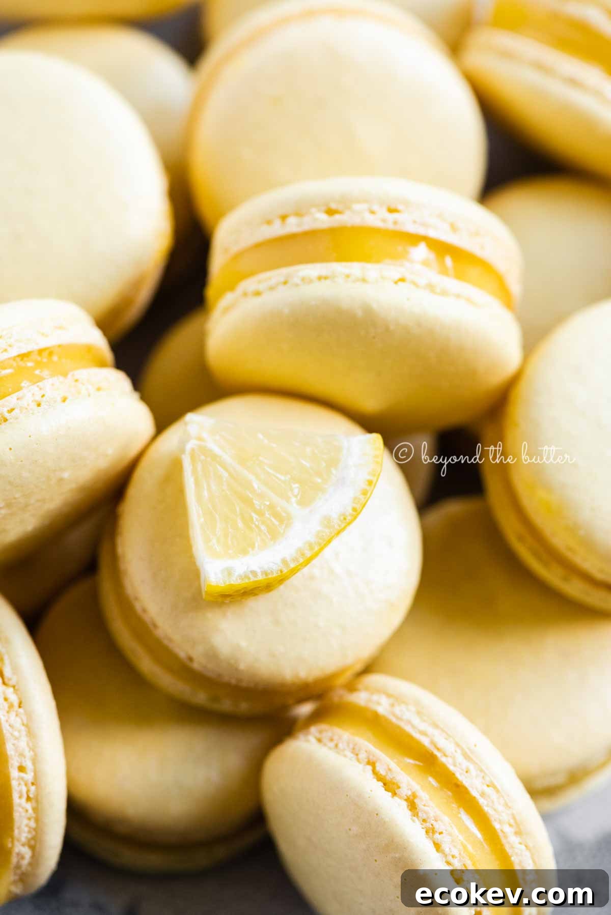 Close up of lemon bar macarons on side | All Images © Beyond the Butter™