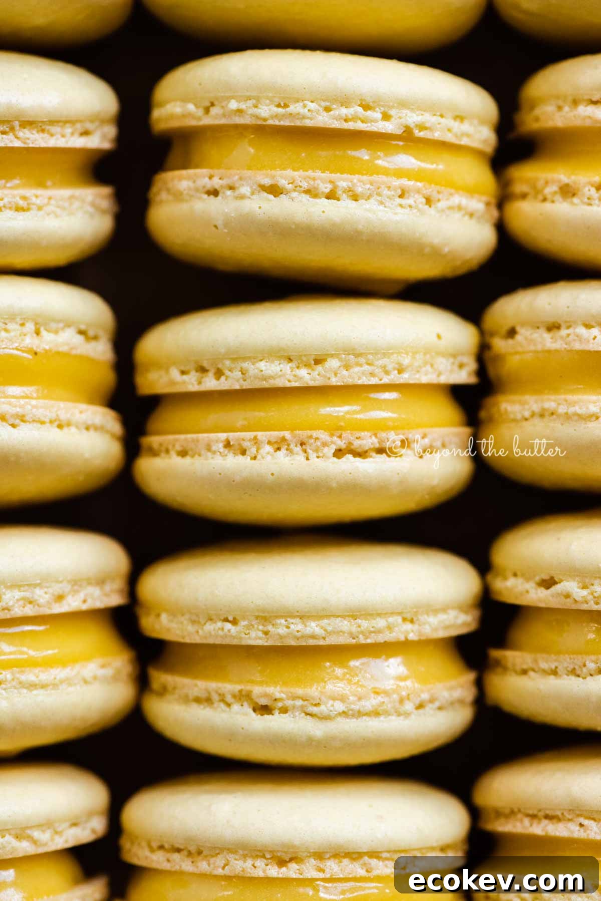 Close up of lemon bar macarons on side | All Images © Beyond the Butter™