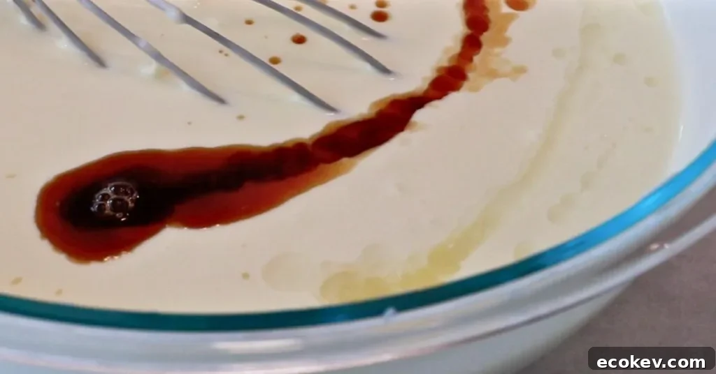 adding vanilla and lemon juice to cheesecake batter