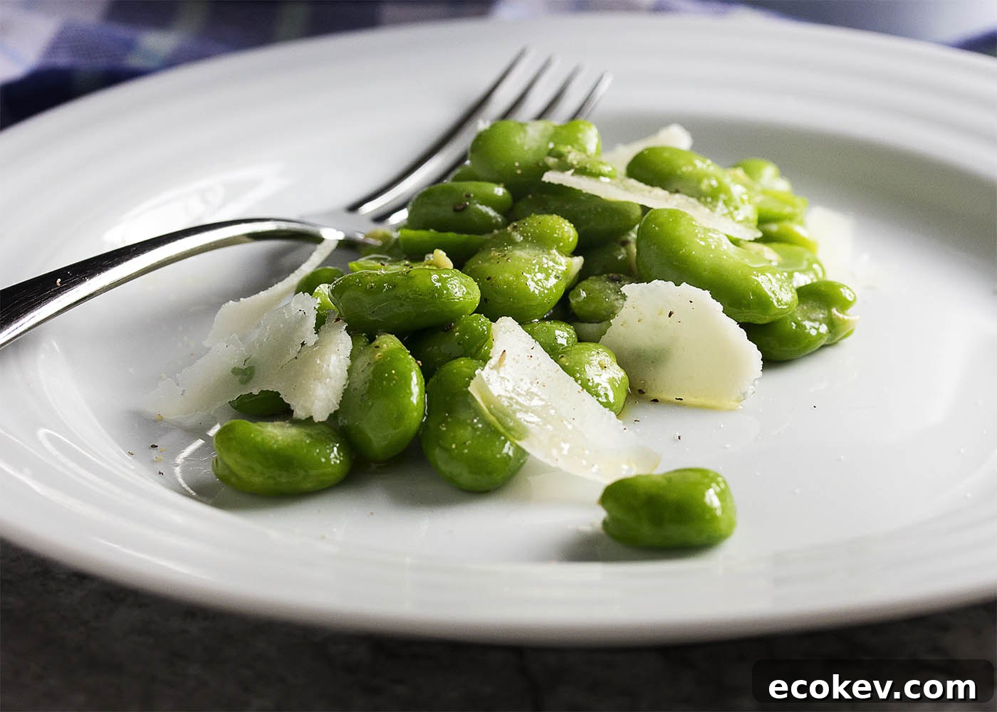 Fava beans tossed with olive oil and garnished with parmesan shavings.