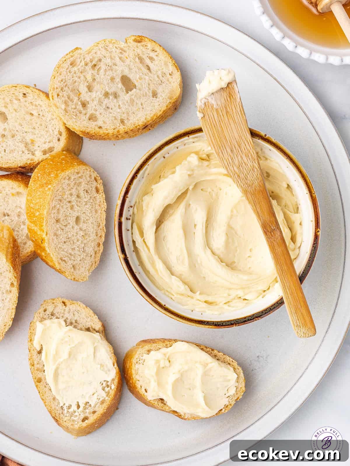 overhead ramekin of butter with butter knife