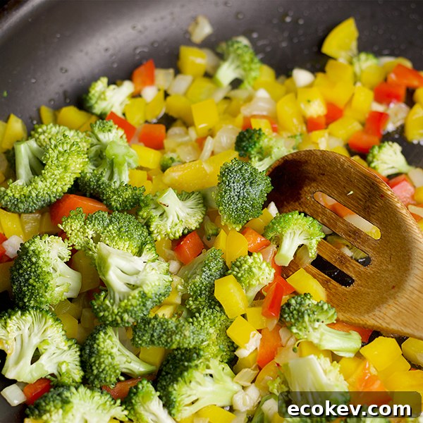 Cooking vegetables for white beans and veggies on toast.