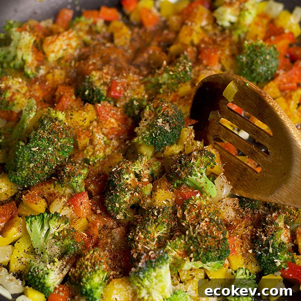 Cooking vegetables and herbs for white beans and veggies on toast.