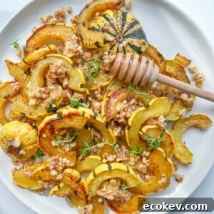 Roasted Delicata Squash slices on a white plate.