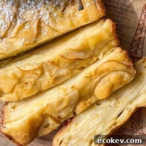 Slices of a golden, layered Invisible Pear Cake.