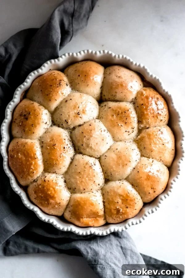 Cheesy garlic herb pull apart rolls in a pan.