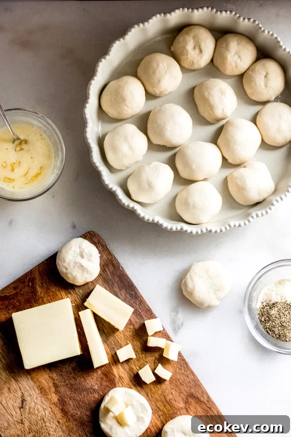A photo of the rolls being stuffed with cheese.