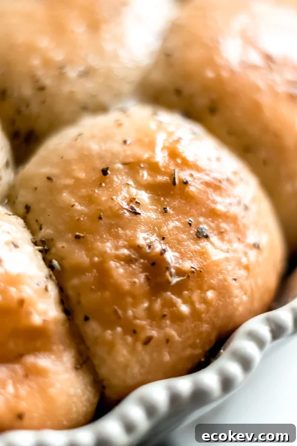 Close-up of a cheesy garlic herb pull apart roll.