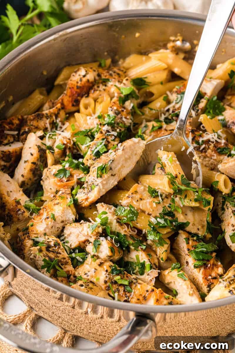 serving the pasta with a metal spoon.