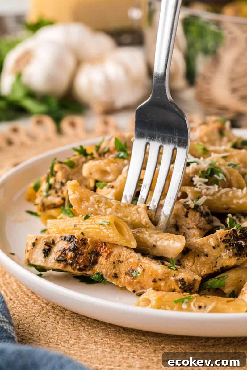 eating the pasta with a fork.