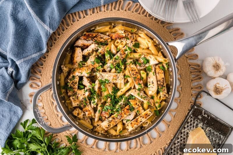 top-down view of the garlic parmesan chicken pasta in a skillet.