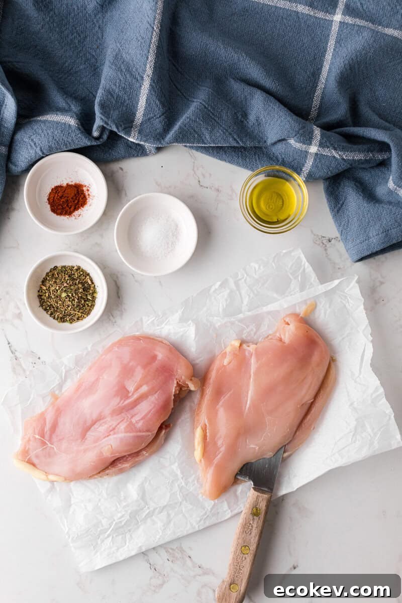 butterflying the chicken breasts to prepare them.