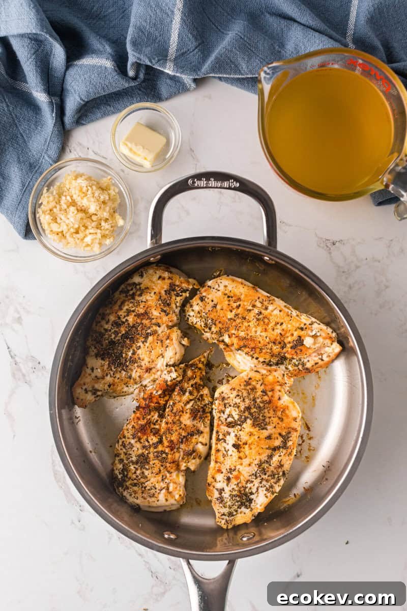 chicken breasts cooked in a skillet.