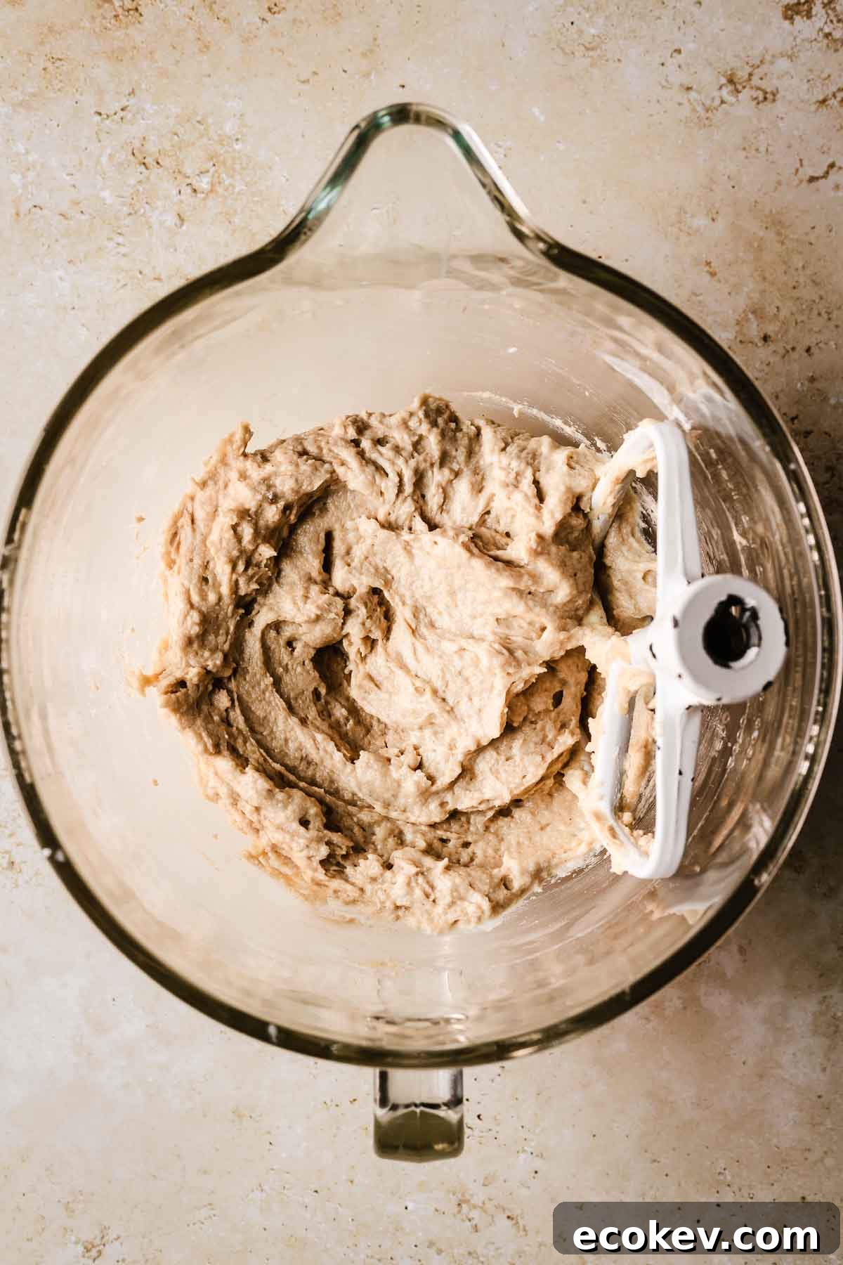 A mixing bowl filled with finished cinnamon streusel muffin batter.
