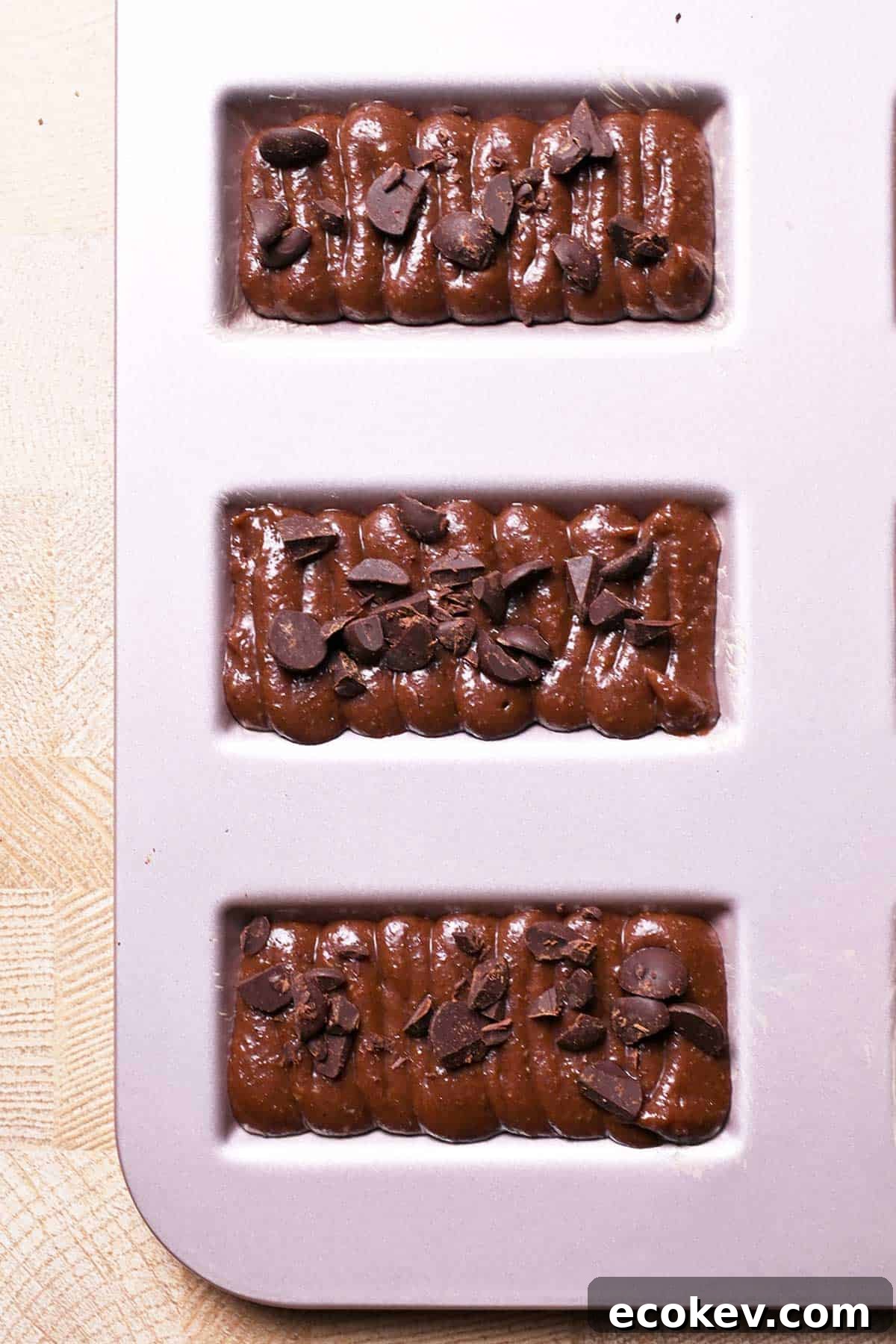 chocolate financier batter with chopped chocolate