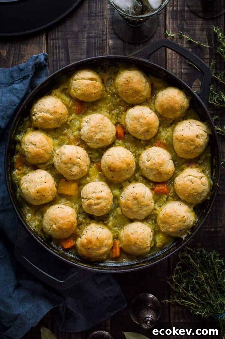 Winter vegetable and pearl barley stew with herby dumplings – a hearty, healthy and filling vegan vegetable stew topped with fluffy, herby dumplings. The perfect meal to warm you up on chilly days. #vegan #healthy