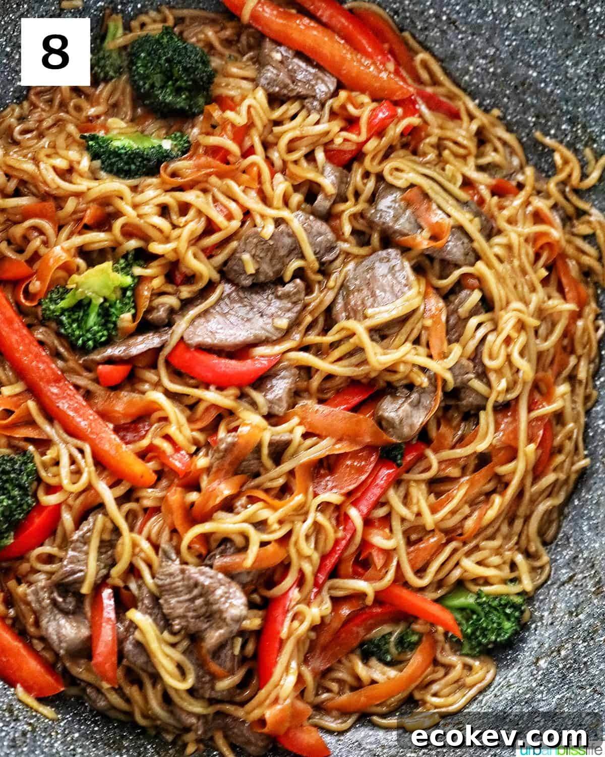 Sesame Garlic Noodles with Steak in a large wok.