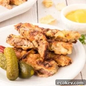 steak fingers on plate with pickles