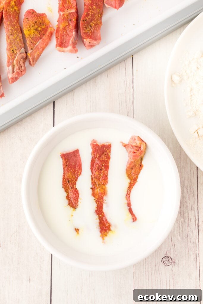 Dip the strips into the buttermilk ...