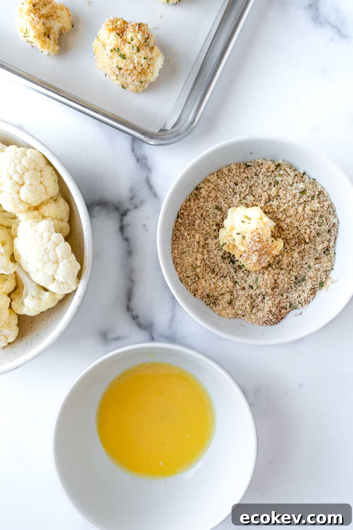 Breading Crispy Cauliflower Bites before baking.