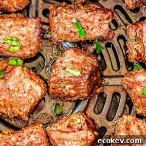 Air Fryer Steak Bites in an air fryer basket.