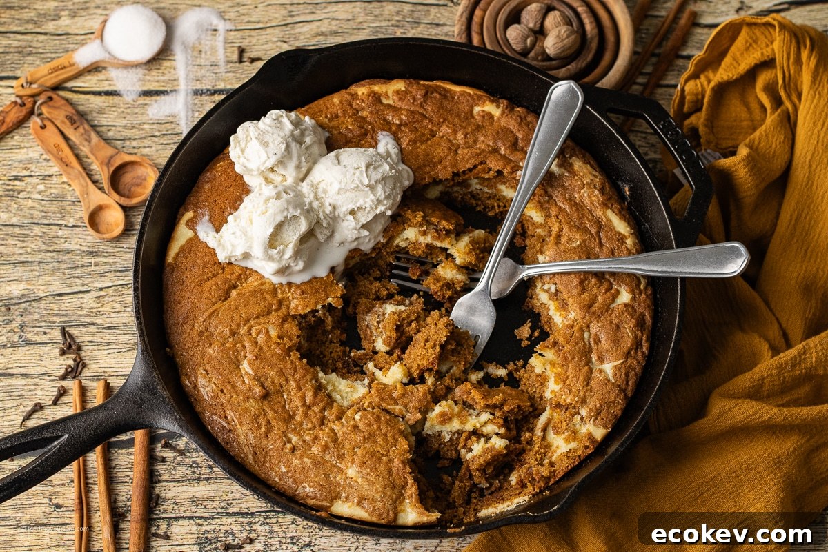 baking a pumpkin cookie with a cheesecake layer in a cast iron skillet
