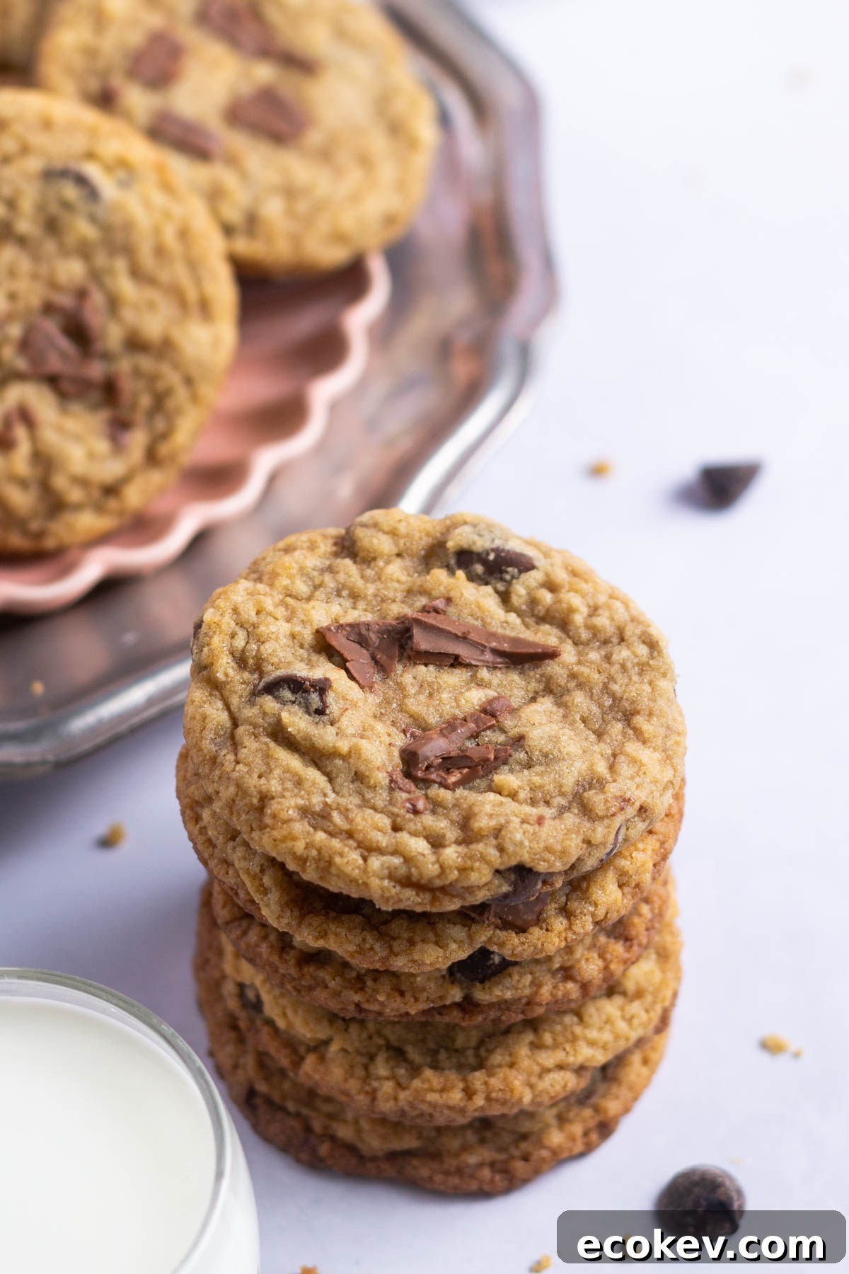 stack of cookies with a glass of milk