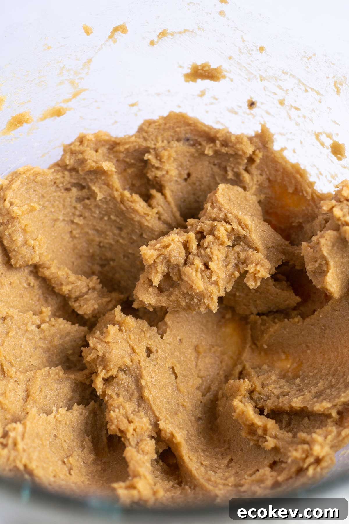butter, sugars, and vanilla creamed together in a mixing bowl