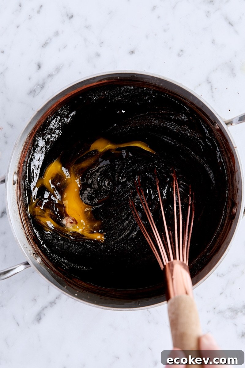 Whisking egg into brownie batter