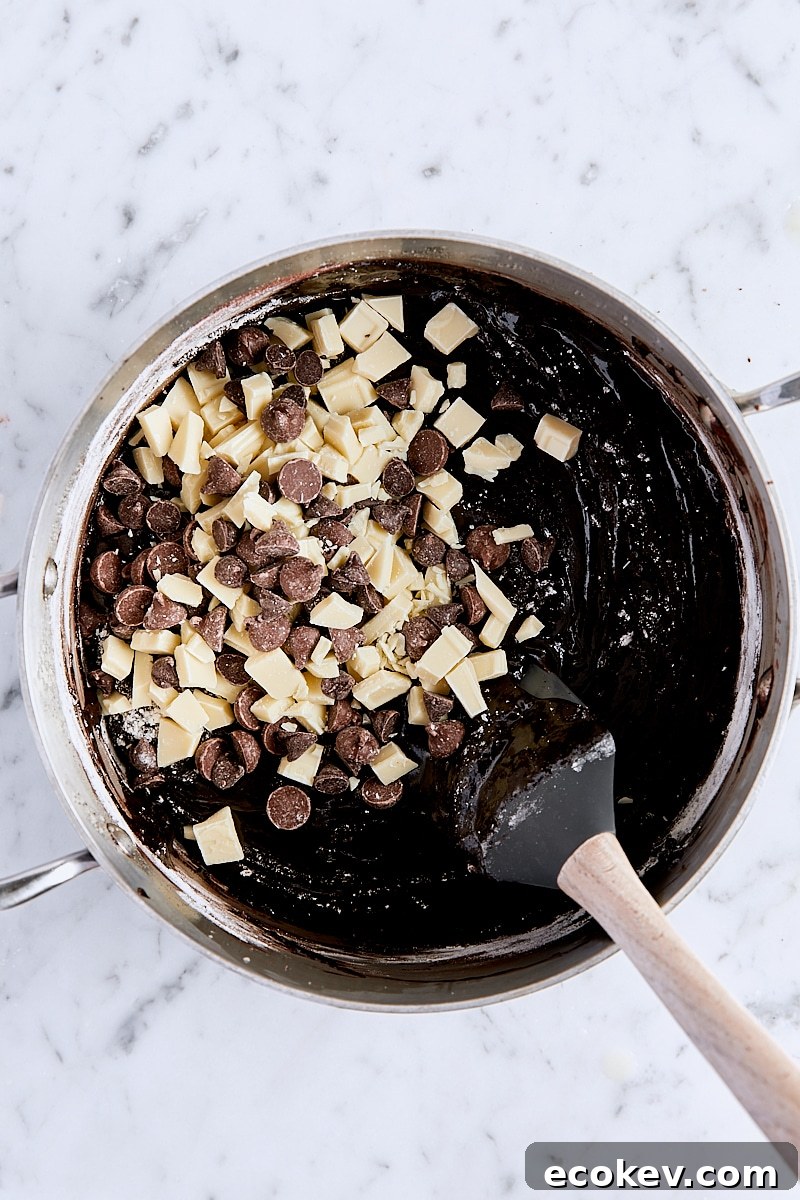 Chopped white chocolate and chocolate chips added to brownie batter
