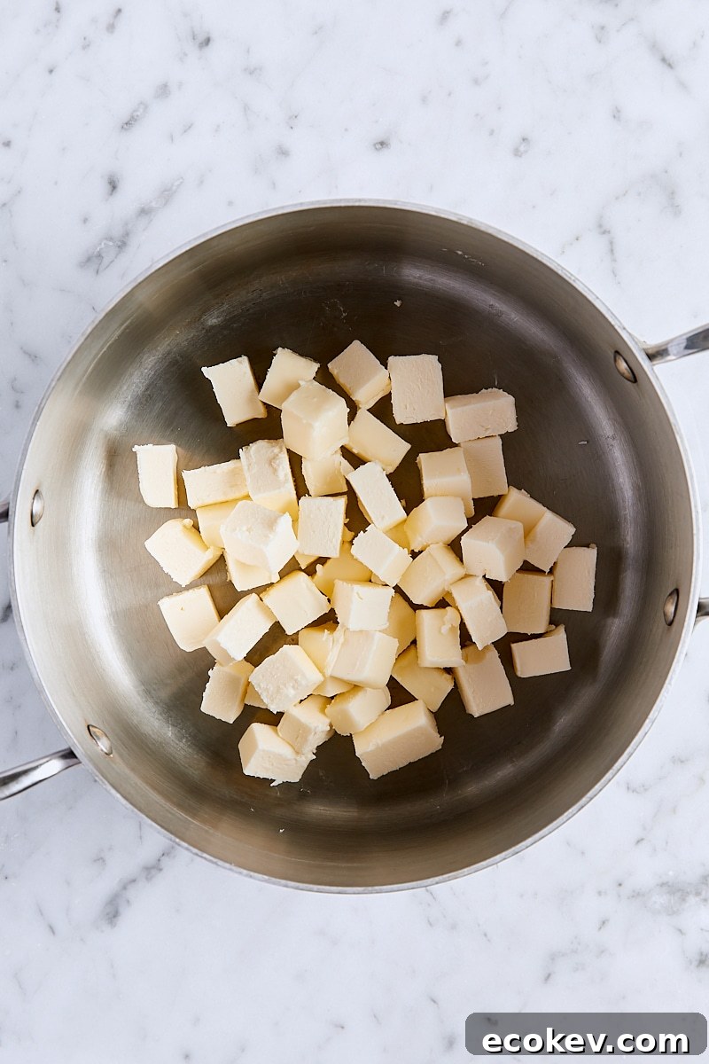 Cubed unsalted butter in saucepan