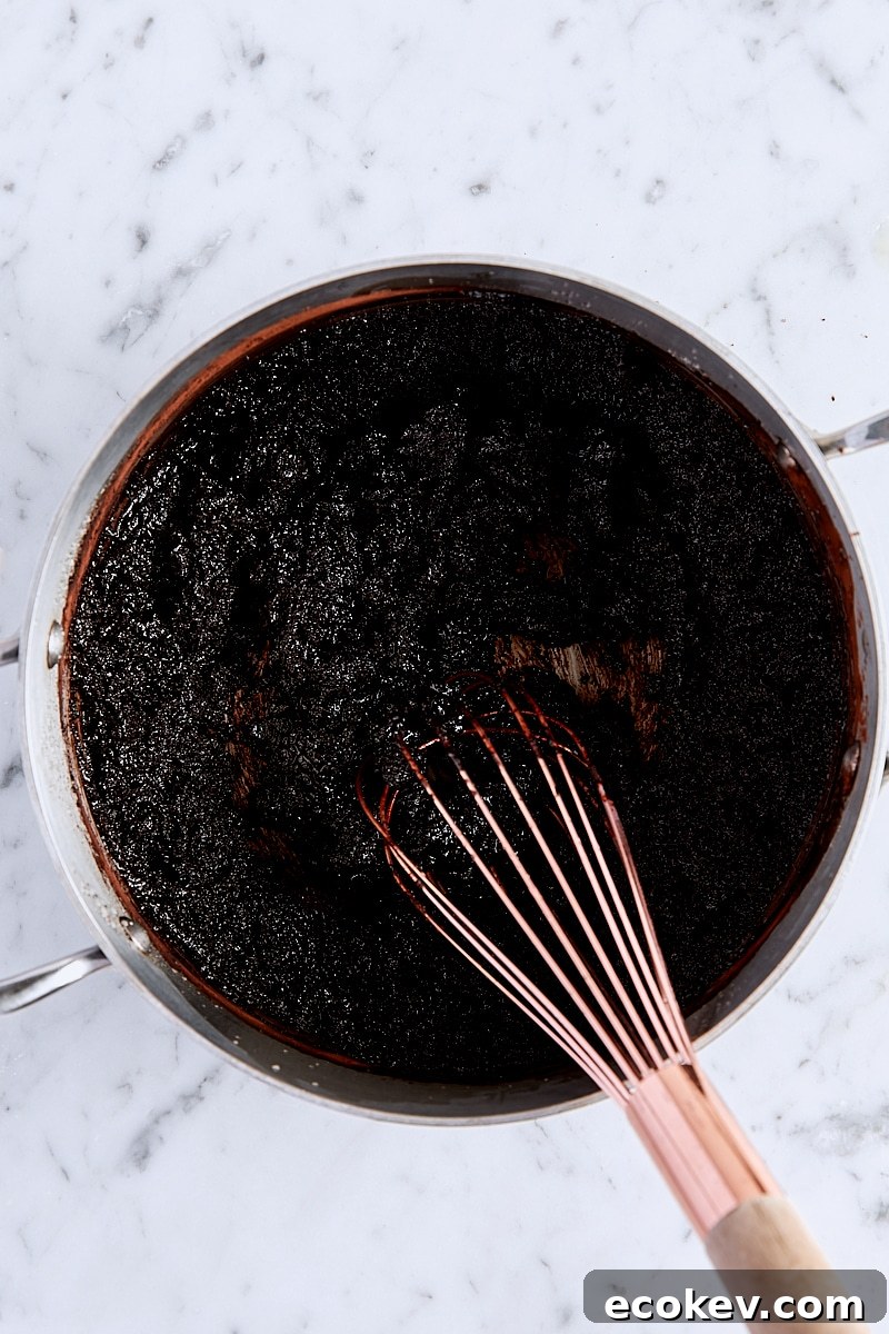 Cocoa powder and salt whisked into butter-sugar mixture