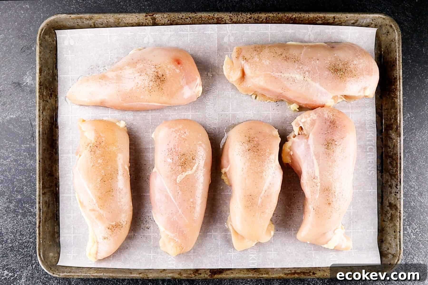 chicken breasts on baking sheet uncooked