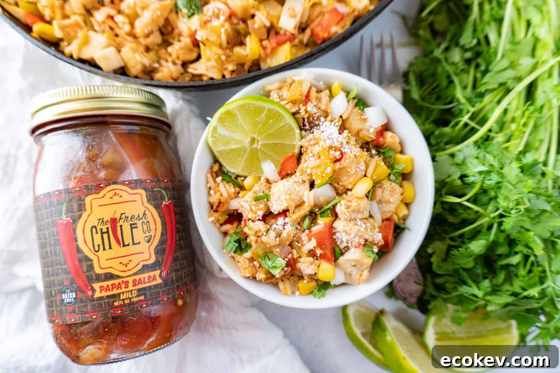 southwest chicken in bowl with salsa jar next to it