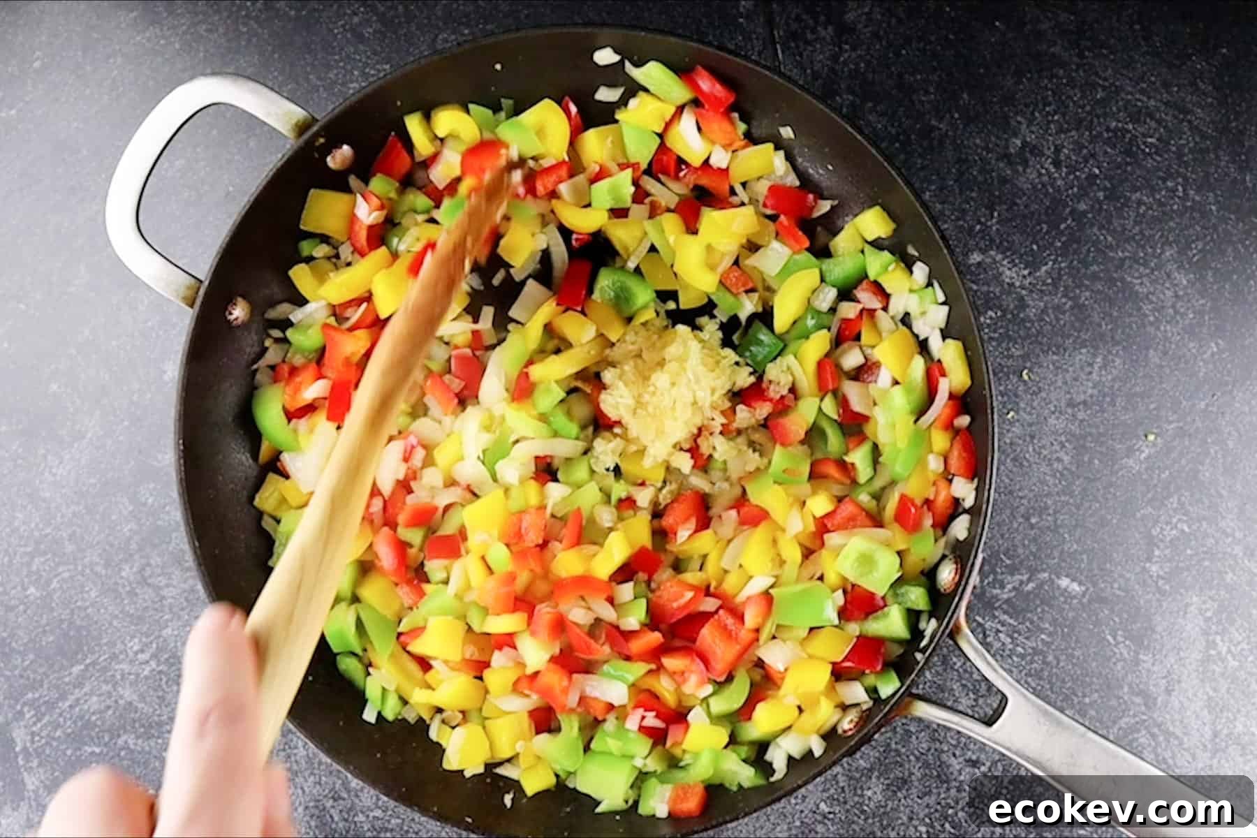 adding garlic to skillet