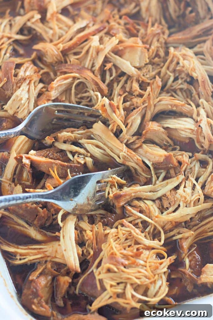 Shredded meat in a crock pot.