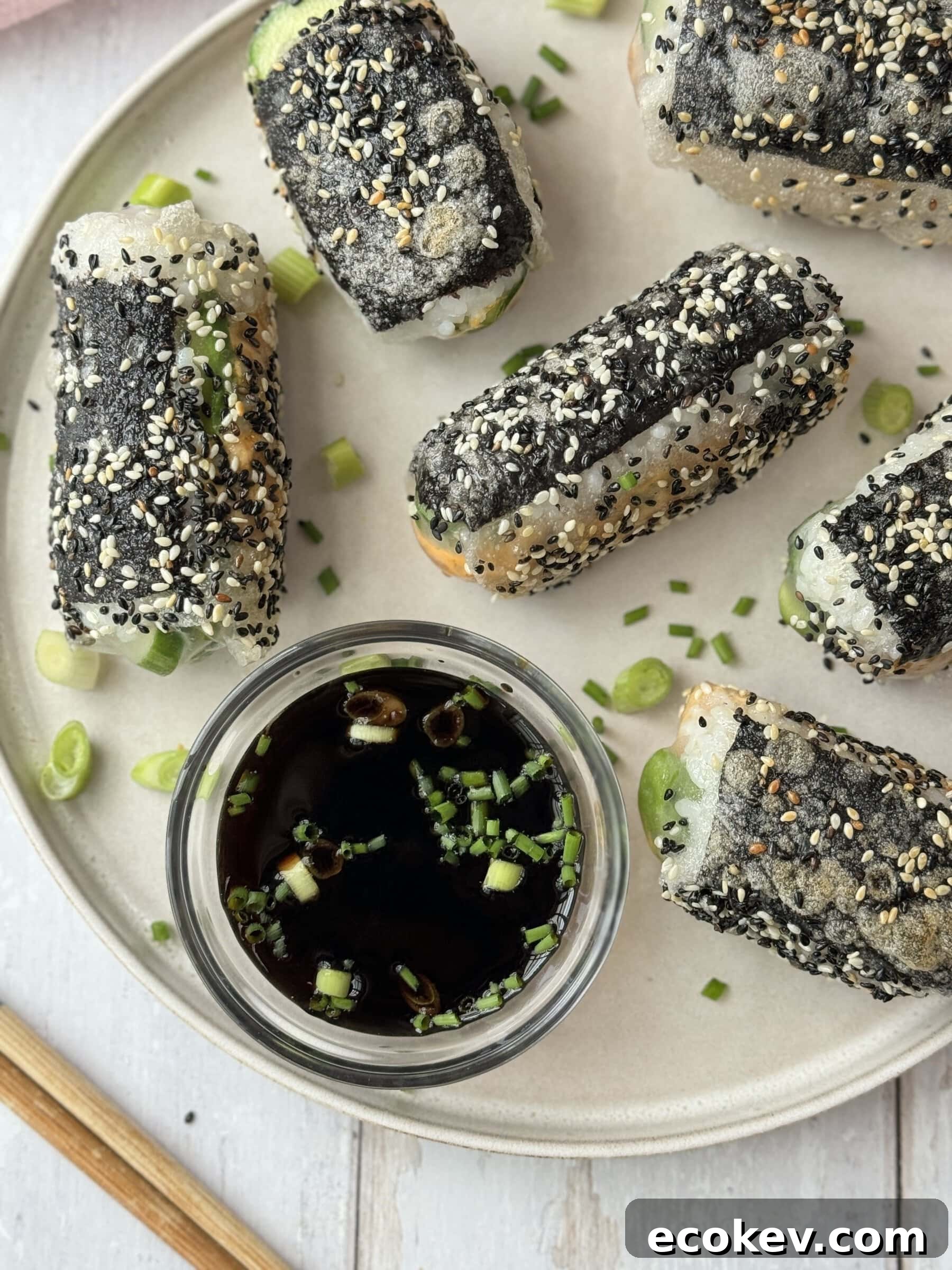Serving the crispy rice paper rolls with the sauce.