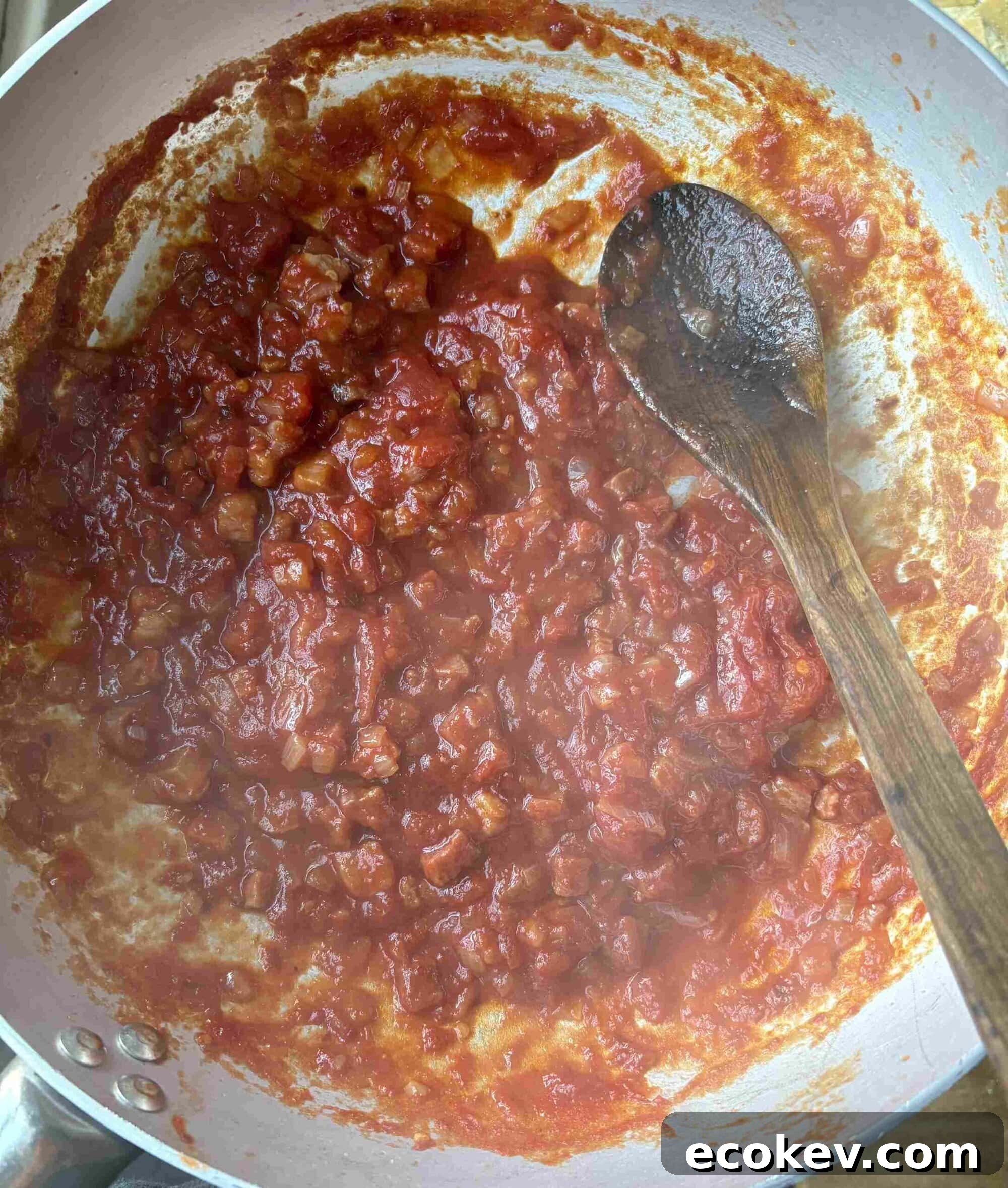 simmering amatriciana sauce.