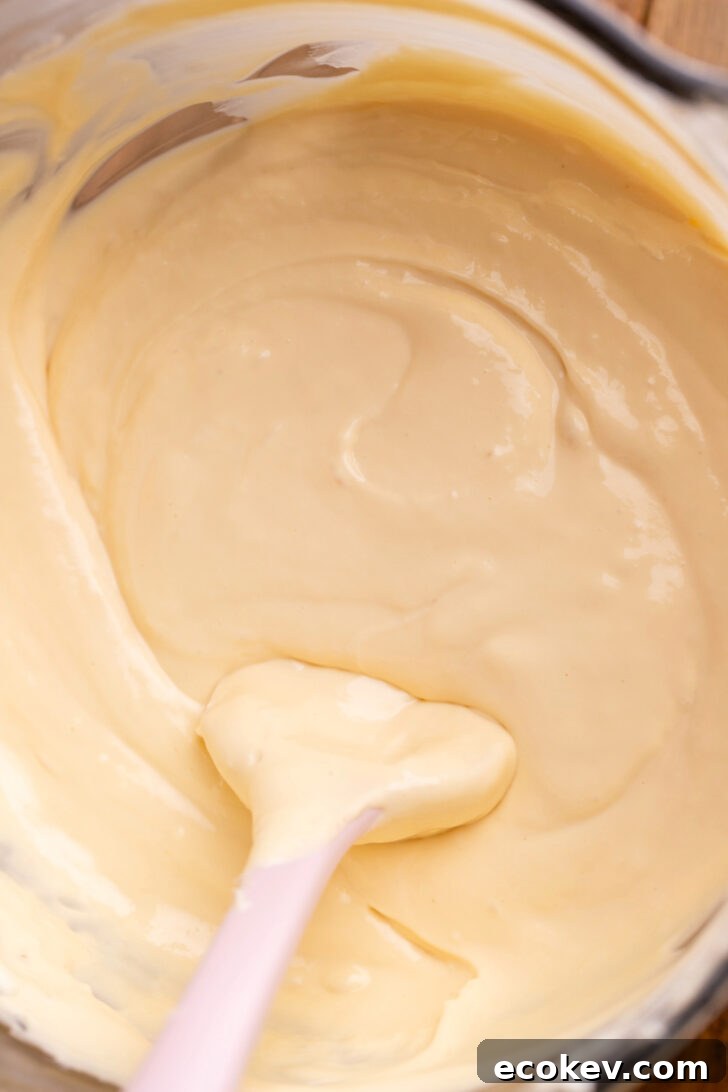 Caramel cheesecake batter in a bowl.