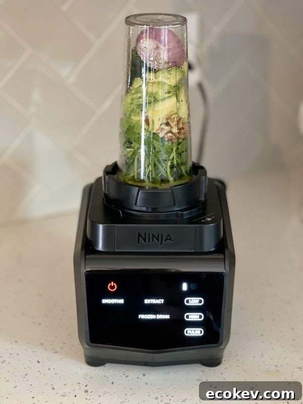 A blender filled with ingredients for dressing.