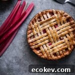 Rhubarb apple pie with an interwoven lattice crust.