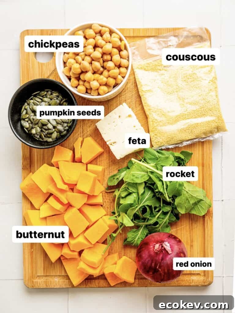 Roasted Pumpkin and Couscous Salad with Feta and Herbs 4 Pumpkin and Couscous salad ingredients spread out on a chopping board.