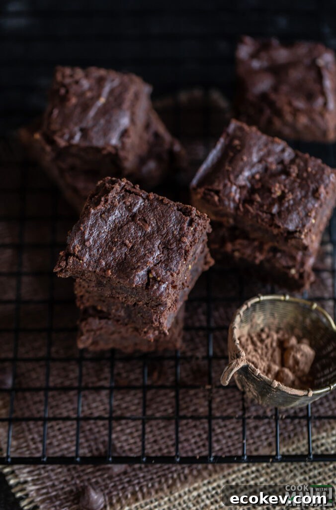 Eggless Besan (Chickpea Flour) Brownies Recipe 8 brownies arranged on a cooling rack