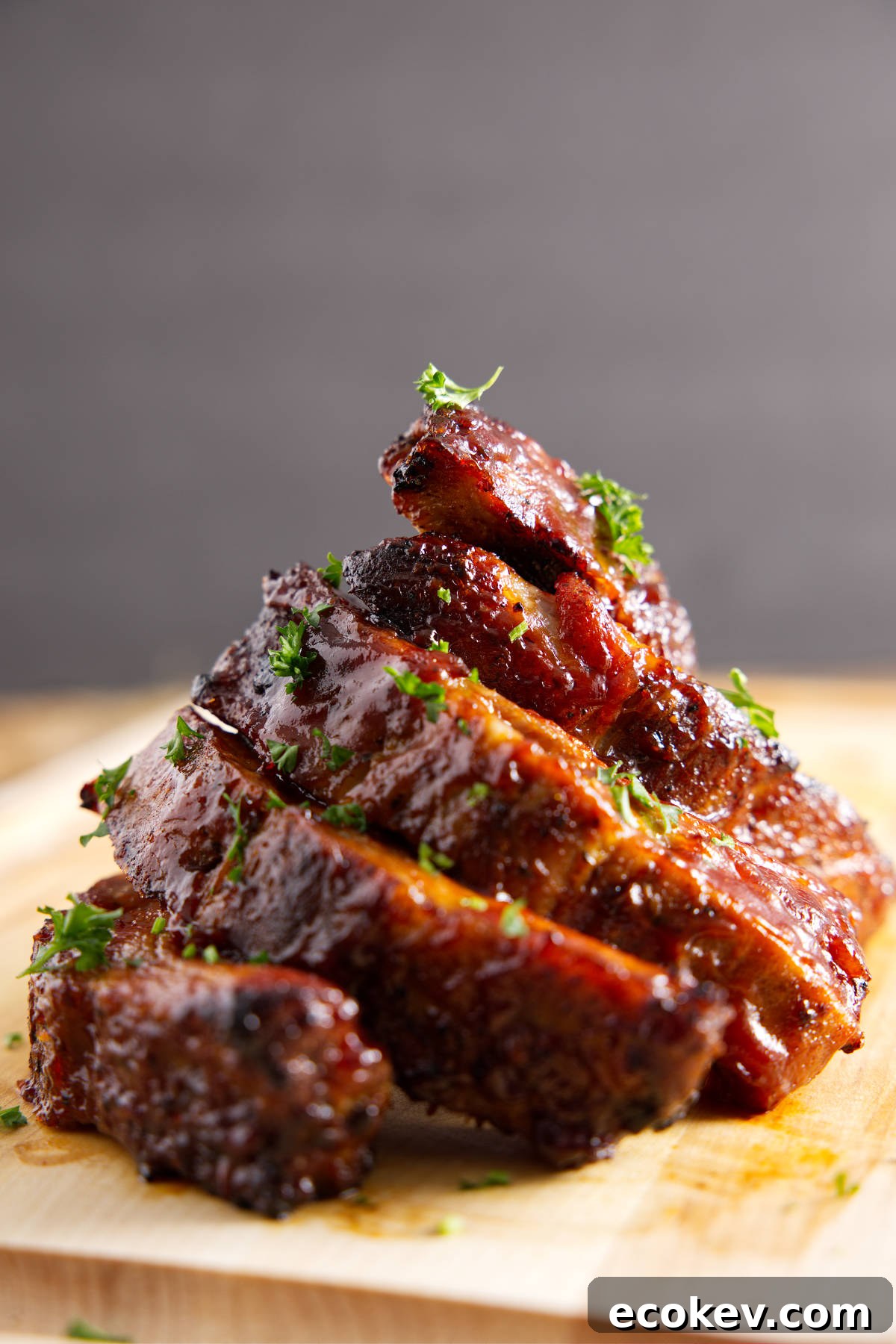 Stack of saucy BBQ pork ribs.